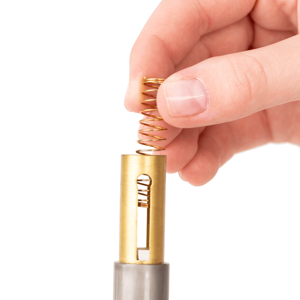 Close-up of KGUmusic bronze trumpet valve spring.