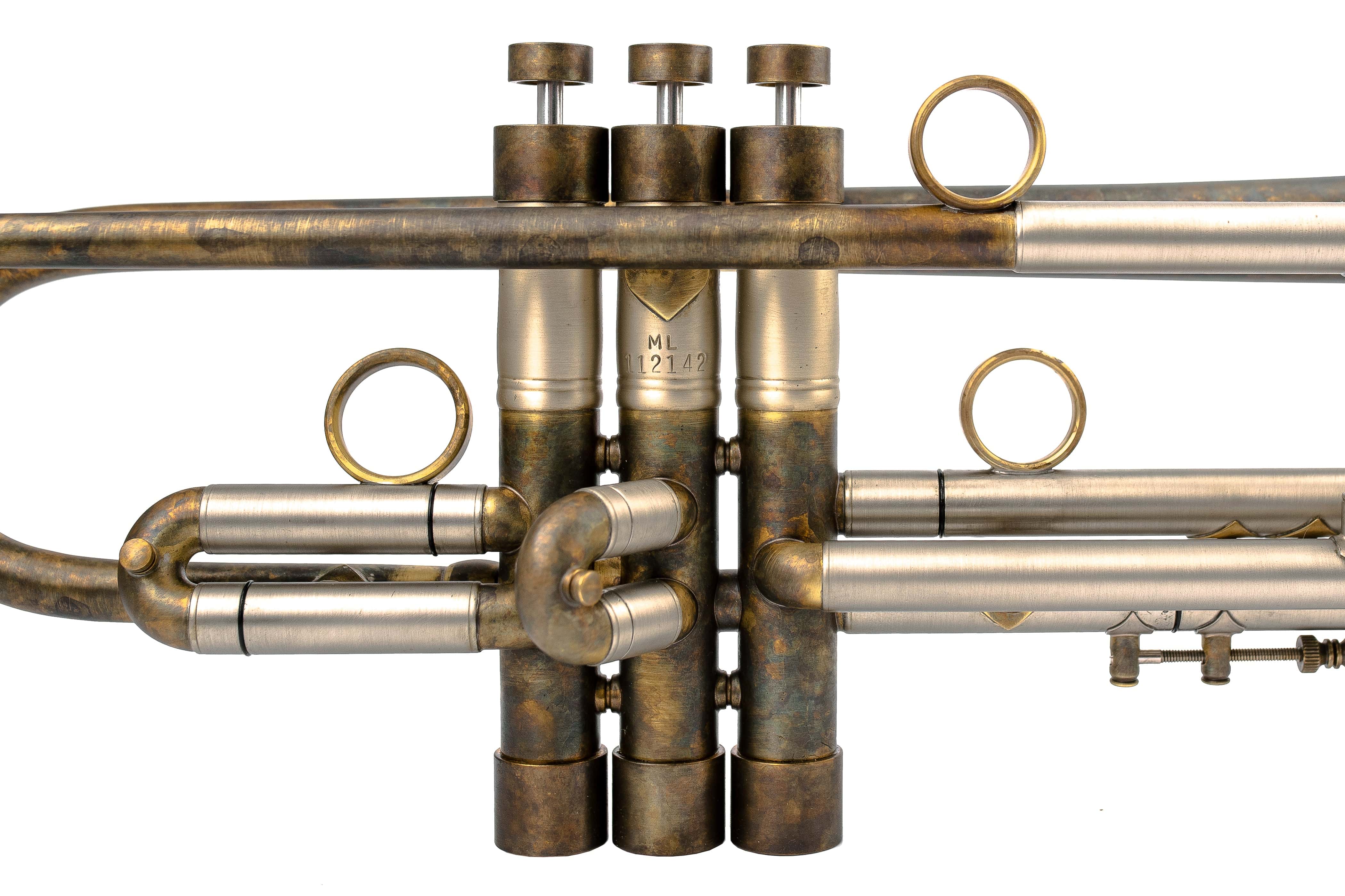 Close-up of KGUmusic’s military-style Bach Stradivarius 180-37 trumpet valves on white.