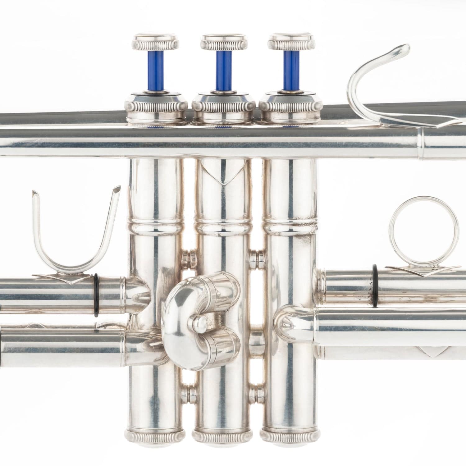 Three KGUmusic Blue Lacquer brass valve stems attached to a trumpet.