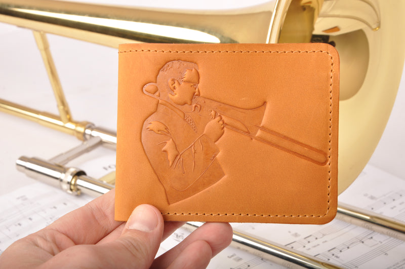 Leather Wallet with a print of a musician playing on the trombone
