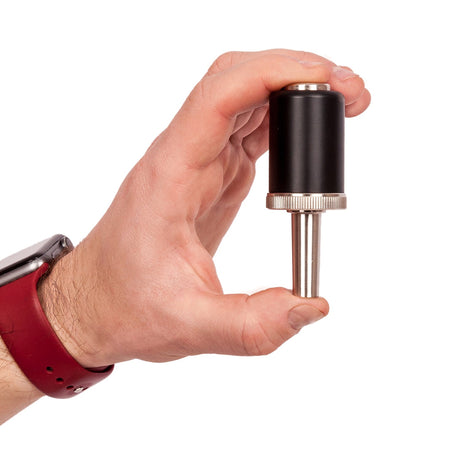 KGUmusic trumpet pressure optimizer in man's hand.